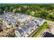 Aerial view of community showcasing modern townhomes, tree-lined streets, and vibrant neighborhood setting at 419 Hargrove Ln, Decatur, GA 30030
