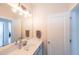 Bathroom featuring a wide mirror, modern lighting, and a sleek vanity with ample counter space at 419 Hargrove Ln, Decatur, GA 30030
