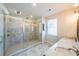 Modern bathroom featuring a glass shower, tile surround, and double vanity at 419 Hargrove Ln, Decatur, GA 30030