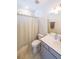 Bathroom with tile floors, shower with curtain, vanity and sink, and natural light at 419 Hargrove Ln, Decatur, GA 30030