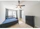 Sunny bedroom with a ceiling fan, large windows, and black furniture, offering a comfortable space at 419 Hargrove Ln, Decatur, GA 30030