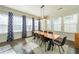 Dining room featuring a modern light fixture, hardwood floors, and large windows at 419 Hargrove Ln, Decatur, GA 30030