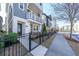 Charming three-story home featuring a balcony, white trim, and a well-maintained yard at 419 Hargrove Ln, Decatur, GA 30030