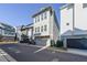 Modern townhome with a two-car garage, neutral siding, and a clean architectural design at 419 Hargrove Ln, Decatur, GA 30030