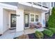 Inviting front porch with outdoor seating and well-maintained landscaping at 419 Hargrove Ln, Decatur, GA 30030