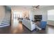 Open-concept living room featuring hardwood floors, staircase, and views into the kitchen at 419 Hargrove Ln, Decatur, GA 30030