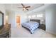 Serene main bedroom with tray ceiling, plush carpet, and ensuite bathroom entrance at 419 Hargrove Ln, Decatur, GA 30030