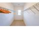 Bright walk-in closet with carpet, shelving and storage perfect for organizing clothes and shoes at 419 Hargrove Ln, Decatur, GA 30030