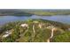 Aerial view of multiple homes along winding roads in a lush, wooded area near the lake at 840 Old Driver Road, Whitesburg, GA 30185