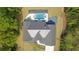 Aerial view of a stunning home with a pool, surrounded by beautifully landscaped grounds and mature trees at 840 Old Driver Road, Whitesburg, GA 30185