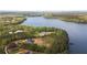 Stunning aerial shot of lake houses amid green trees, beside a pristine blue lake at 840 Old Driver Road, Whitesburg, GA 30185