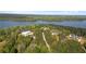Lovely aerial view showcasing houses with private driveways surrounded by trees, near a lake at 840 Old Driver Road, Whitesburg, GA 30185
