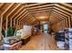 A spacious unfinished attic with exposed wooden beams offering potential for extra storage or customization at 840 Old Driver Road, Whitesburg, GA 30185