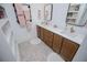 Elegant bathroom featuring double sinks, decorative tiles, and modern fixtures, creating a relaxing space at 840 Old Driver Road, Whitesburg, GA 30185