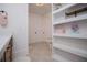 Bathroom featuring unique tile floors, storage shelving, and wood cabinets at 840 Old Driver Road, Whitesburg, GA 30185