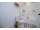 Bright bathroom with white subway tile, gold fixtures, decorative floor, and a tub shower combo at 840 Old Driver Road, Whitesburg, GA 30185