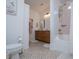 Charming bathroom featuring unique tile floors, wood cabinets, large bathtub and elegant pink-themed decor at 840 Old Driver Road, Whitesburg, GA 30185