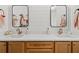 Bathroom featuring double vanity with granite counters, modern fixtures, and wood cabinets at 840 Old Driver Road, Whitesburg, GA 30185