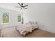 Bright bedroom featuring natural light, hardwood flooring, and comfortable bed setup for relaxation at 840 Old Driver Road, Whitesburg, GA 30185