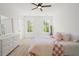 Inviting bedroom bathed in natural light with hardwood floors and a plush bed offering a restful ambiance at 840 Old Driver Road, Whitesburg, GA 30185