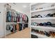 Spacious closet with custom shelving and rods provides abundant storage for clothing and accessories at 840 Old Driver Road, Whitesburg, GA 30185