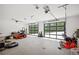 A spacious three car garage with modern glass panel doors at 840 Old Driver Road, Whitesburg, GA 30185