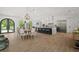 Spacious kitchen flows into the dining room, perfect for entertaining, featuring modern, stainless appliances at 840 Old Driver Road, Whitesburg, GA 30185