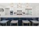 Stunning kitchen island with bar stool seating features granite countertops, stainless appliances, and lots of storage at 840 Old Driver Road, Whitesburg, GA 30185