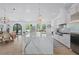 Open-concept kitchen and dining area is great for entertaining and features modern pendant lighting at 840 Old Driver Road, Whitesburg, GA 30185