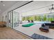 This elegant living room boasts hardwood floors and large windows with views of the covered patio at 840 Old Driver Road, Whitesburg, GA 30185