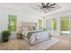The main bedroom offers an en-suite bathroom, large windows, and abundant natural light at 840 Old Driver Road, Whitesburg, GA 30185