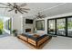 Outdoor covered patio with a stone fireplace, wooden couch and coffee table at 840 Old Driver Road, Whitesburg, GA 30185