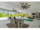 Entertain guests on this expansive covered patio with a dining area, fireplace, and putting green at 840 Old Driver Road, Whitesburg, GA 30185