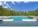Gorgeous swimming pool and spa with a manicured backyard and blue skies at 840 Old Driver Road, Whitesburg, GA 30185