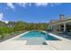 Stunning pool featuring a tanning ledge and spa, complemented by lounge chairs for relaxation at 840 Old Driver Road, Whitesburg, GA 30185