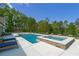 Beautiful pool and spa with lounge chairs and dining area, perfect for outdoor entertaining at 840 Old Driver Road, Whitesburg, GA 30185