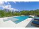 Inviting pool with tanning ledge, spa, and ample lounge space, ideal for enjoying sunny days at 840 Old Driver Road, Whitesburg, GA 30185