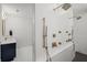 Modern walk-in shower featuring multiple shower heads and controls, next to blue vanity at 840 Old Driver Road, Whitesburg, GA 30185