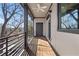 Inviting balcony featuring an exterior door, ceiling fan, and views of the surrounding neighborhood at 147 Hutchinson Ne St, Atlanta, GA 30307