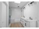 Modern bathroom featuring a shower, and vanity with double sinks at 147 Hutchinson Ne St, Atlanta, GA 30307