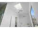 Modern bathroom featuring a shower, skylight, and vanity with double sinks at 147 Hutchinson Ne St, Atlanta, GA 30307