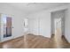 Spacious bedroom with hardwood floors, access to a private balcony, and ample natural light at 147 Hutchinson Ne St, Atlanta, GA 30307