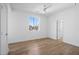 Bright bedroom with a ceiling fan and hardwood floors at 147 Hutchinson Ne St, Atlanta, GA 30307