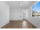 Bright bedroom with a ceiling fan and hardwood floors at 147 Hutchinson Ne St, Atlanta, GA 30307