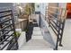 Exterior stairs with metal railing leading to the side yard and back of the house at 147 Hutchinson Ne St, Atlanta, GA 30307