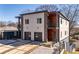 Modern two-story home featuring a two-car garage, stone accents, and balconies at 147 Hutchinson Ne St, Atlanta, GA 30307