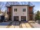 Contemporary home with a two-car garage, stone accents, and a well-designed driveway at 147 Hutchinson Ne St, Atlanta, GA 30307