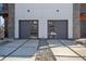 Modern garage doors with glass panels and a contemporary concrete driveway at 147 Hutchinson Ne St, Atlanta, GA 30307