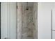 Modern shower with tile surround, glass door, and shower head at 147 Hutchinson Ne St, Atlanta, GA 30307