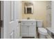 Bright bathroom with a tub and sink at 2593 Fieldstone View Se Ln, Conyers, GA 30013